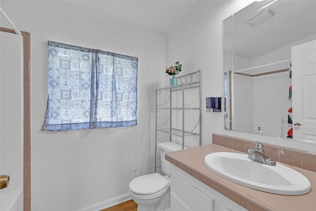 Bathroom featuring a shower, vanity, and a bathtub | Image 20