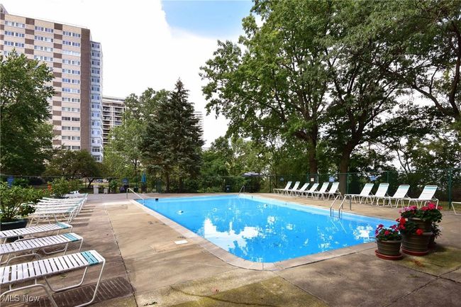 Community pool featuring a patio and fence | Image 39