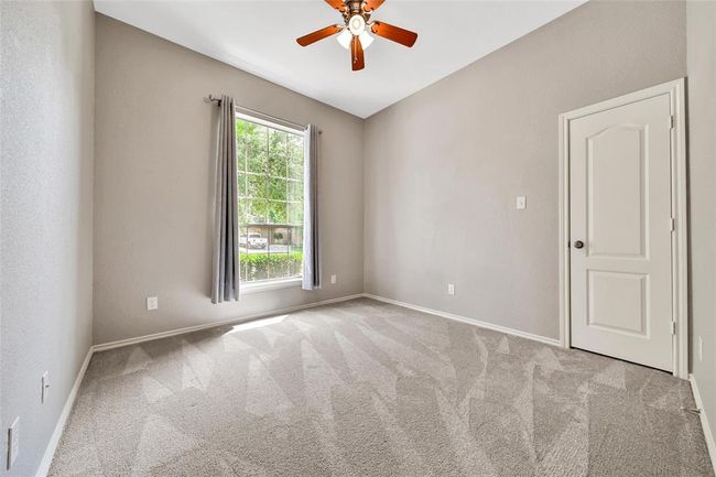 Secondary bedrooms are light and bright with generous closet space. | Image 25