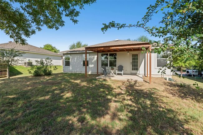 Back of house featuring a patio area, a yard, and stucco siding | Image 26