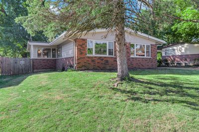 View of front facade with a front lawn | Image 3