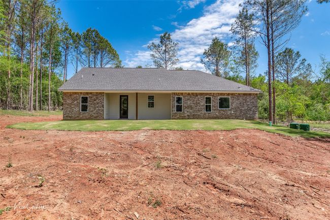 Back of house with a lawn and brick siding | Image 22