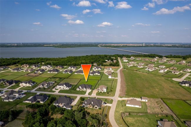 View of property location with a large body of water and nearby suburban area | Image 33