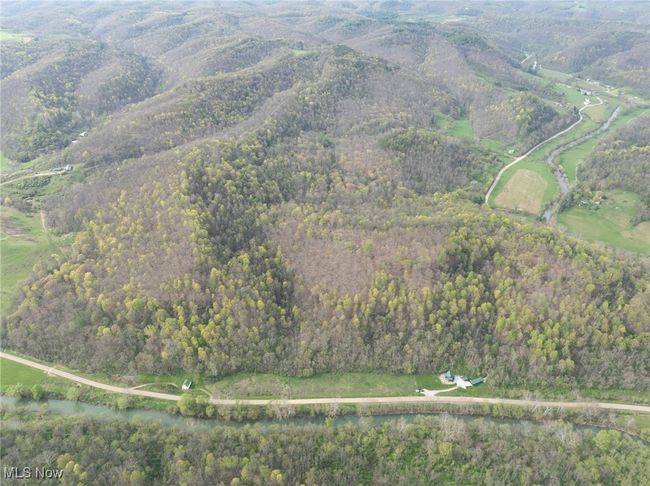 Birds eye view of property featuring a wooded view and a water view | Image 31