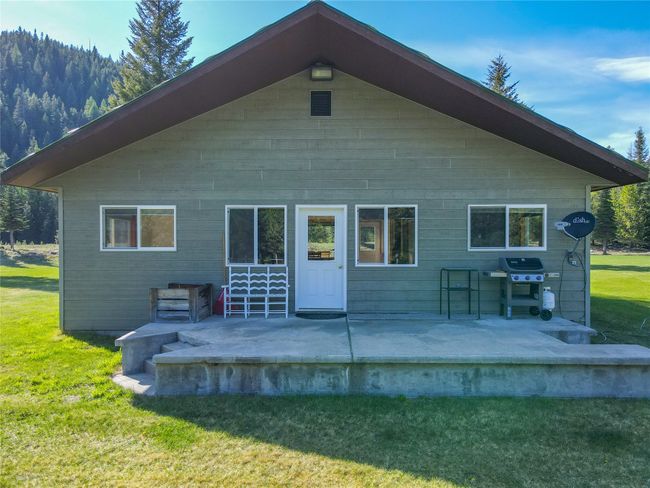 Back of house featuring a yard and a patio | Image 84