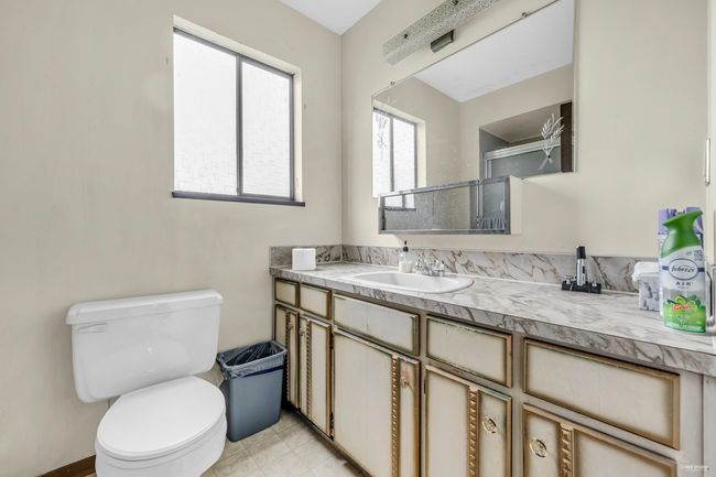 Bathroom featuring vanity, tile patterned flooring, and a shower | Image 19