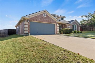 View of front of home featuring a garage and a front lawn | Image 2