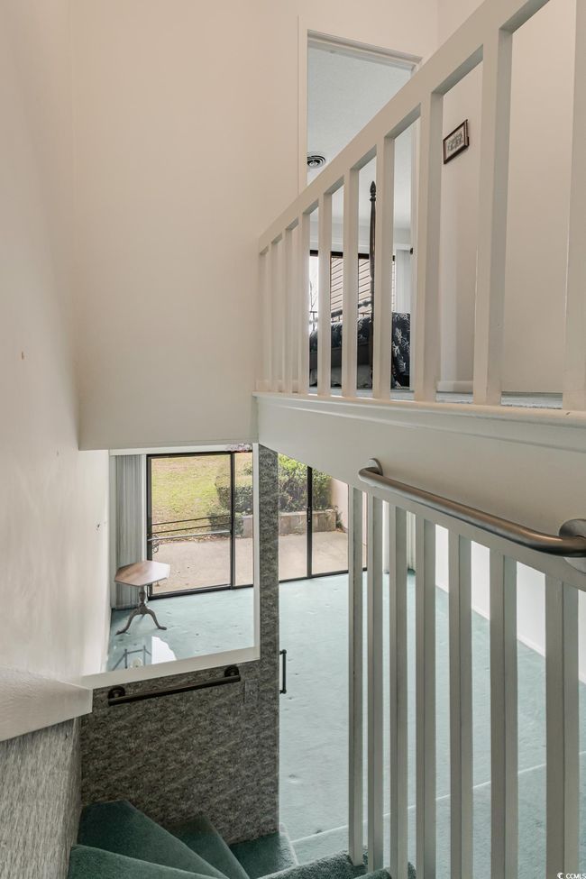 Stairs featuring a towering ceiling | Image 18