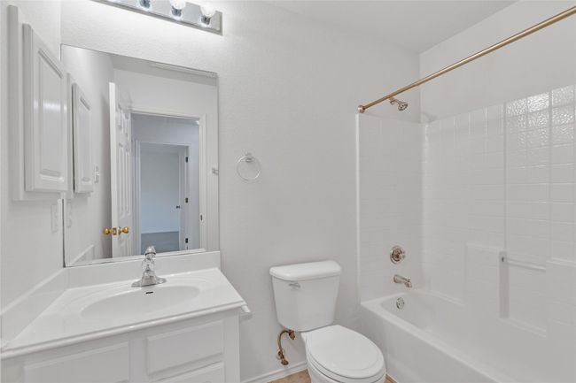 Full bath featuring vanity and shower / washtub combination | Image 16