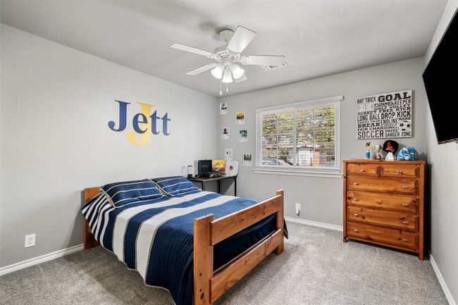 Bedroom with baseboards, carpet floors, and a ceiling fan | Image 27