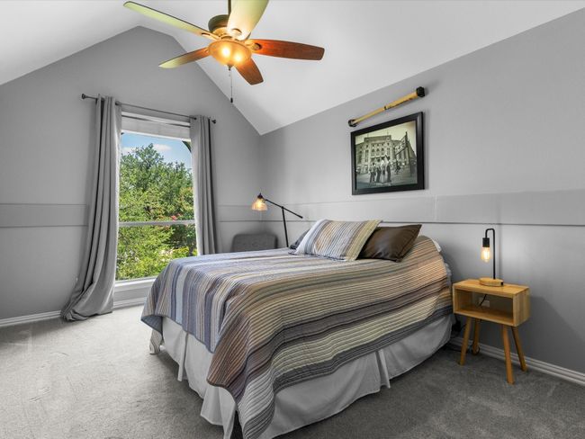 Carpeted bedroom featuring vaulted ceiling and ceiling fan | Image 27