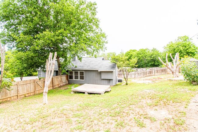 Back of property with a deck and a fenced backyard | Image 25