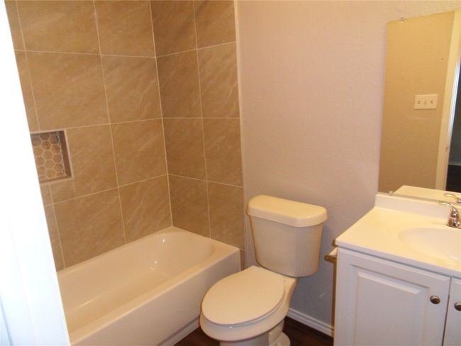 Full bath with vanity, toilet, and bathtub / shower combination | Image 11