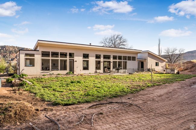 Back of house with a patio, stucco siding, and a mountain view | Image 45