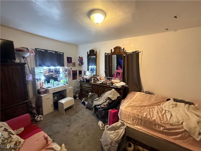 Bedroom with carpet flooring | Image 20