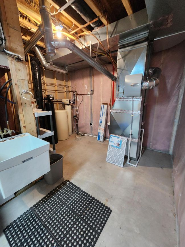 Furnace room with sink & more storage. | Image 17