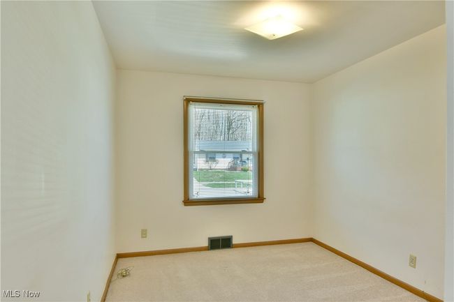 Spare room with baseboards, visible vents, and carpet | Image 27