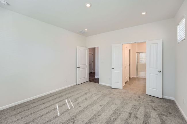 Unfurnished bedroom featuring recessed lighting, baseboards, light carpet, and visible vents | Image 17