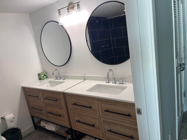 Bathroom featuring double vanity | Image 13
