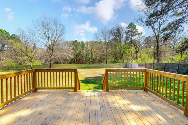 Wooden terrace featuring a yard and a fenced backyard | Image 33