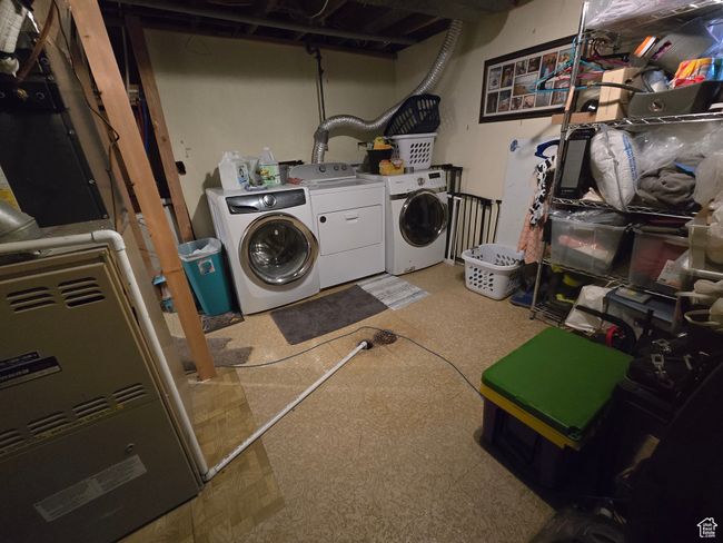 Laundry area featuring washing machine and dryer and laundry area | Image 35