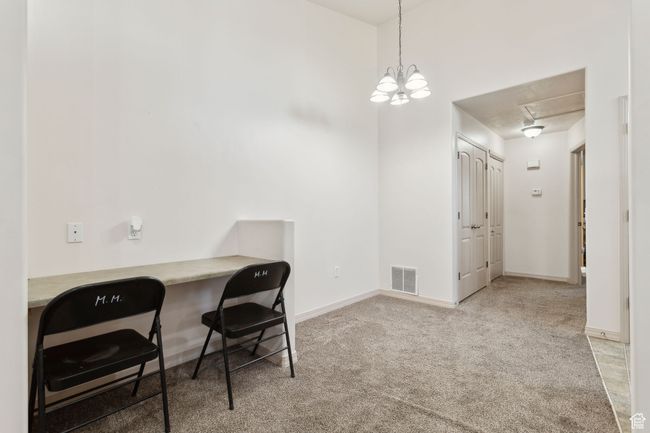 Home office with attic access, carpet, and baseboards | Image 13