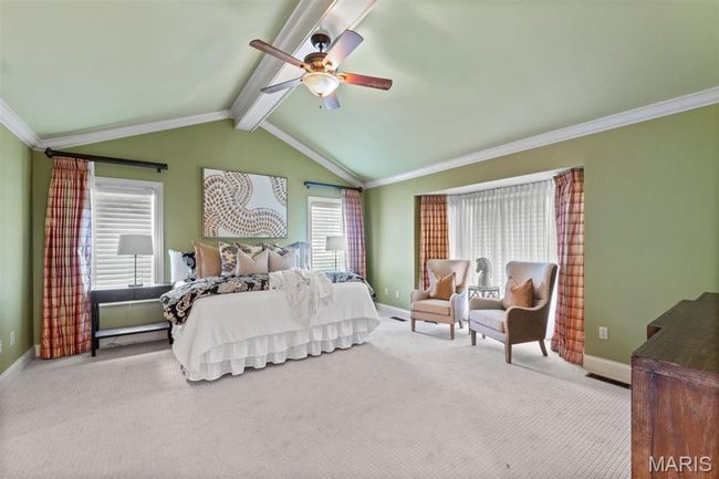 Bedroom with carpet floors, crown molding, and ceiling fan | Image 34