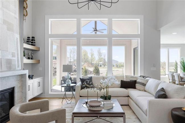 This fabulous living room has tons of light and soaring ceilings. | Image 7
