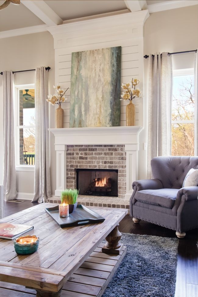 The brick-surround fireplace also includes shiplap. | Image 20