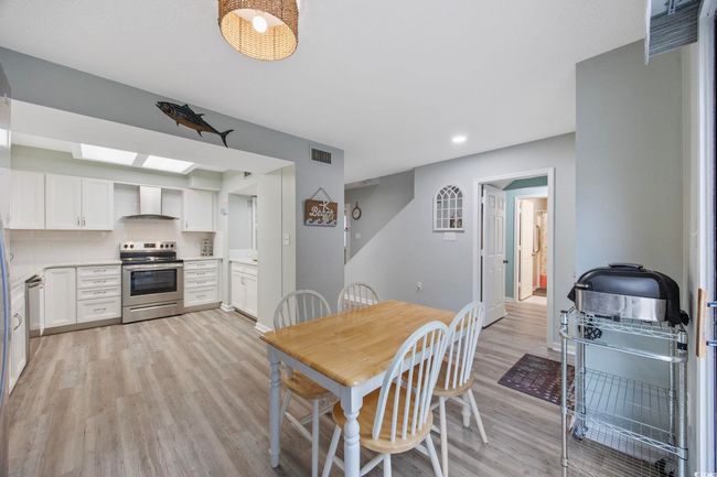 Dining room featuring light wood-style floors, recessed lighting, and baseboards | Image 10