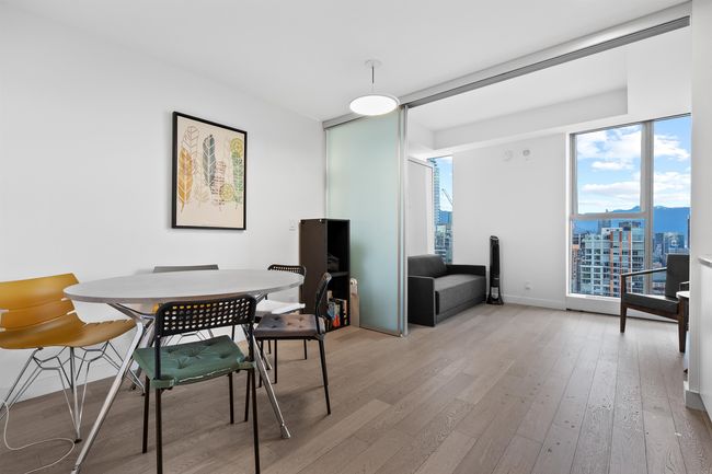 Dining area with light wood-style floors and baseboards | Image 13