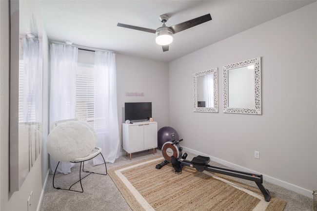 Secondary Bedroom with ceiling fan. | Image 20