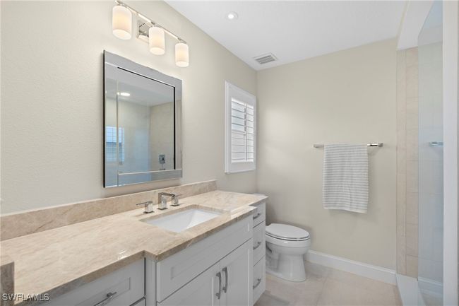 Updated bath with walk-in tile shower, quartz countertops | Image 20
