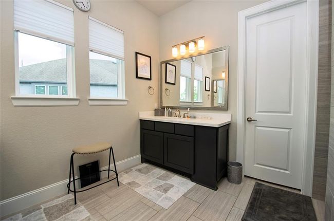 The other vanity and large primary closet. | Image 18