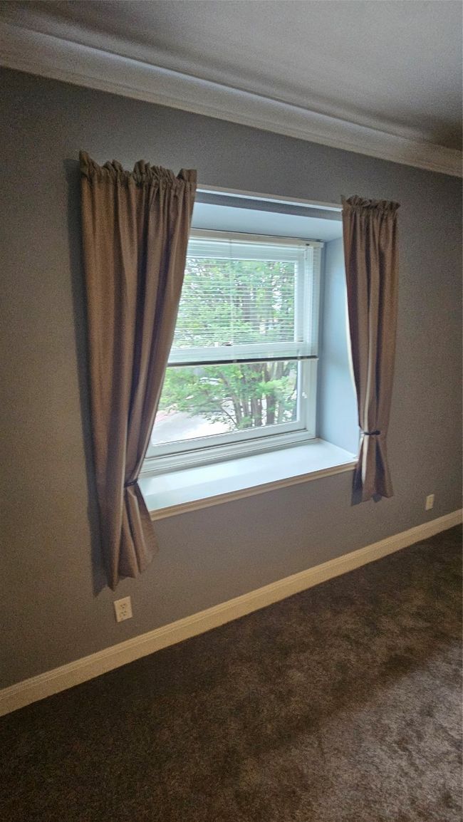 Unfurnished room featuring carpet and crown molding | Image 27