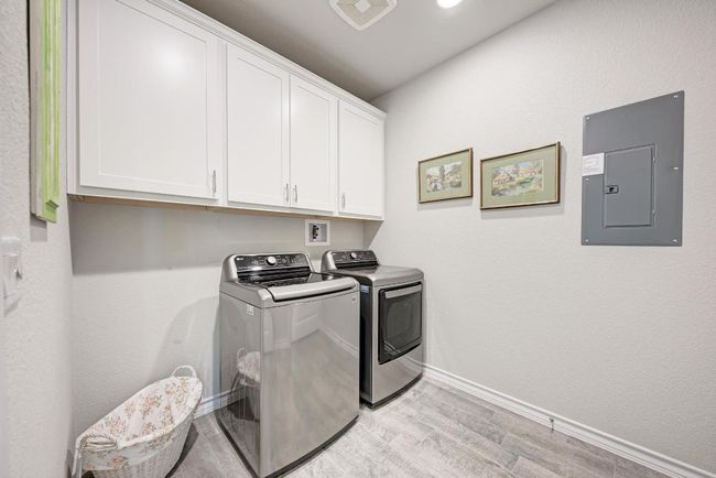 Laundry room with built-in cabinets | Image 16