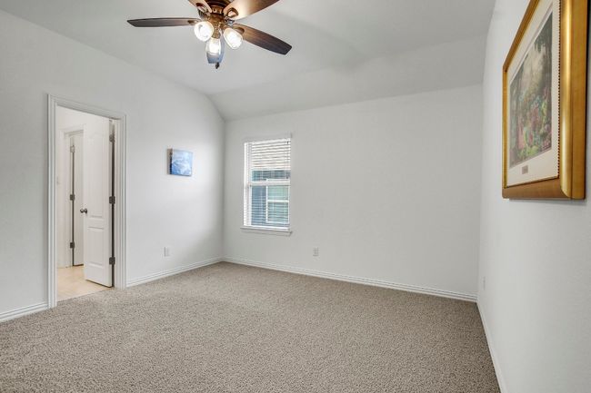 Second room with upgraded carpet, a ceiling fan, and vaulted ceiling | Image 30