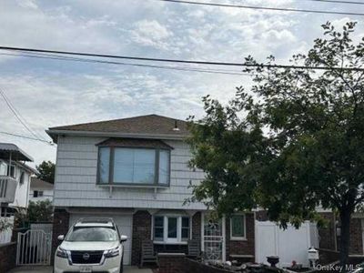 View of front of house featuring a garage | Image 1