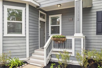 Step onto the porch of this charming home, where classic style meets modern convenience. | Image 3