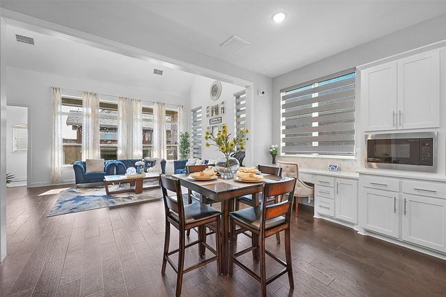 Breakfast nook showing the built in study area behind. | Image 13