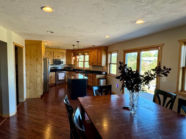 Dining room view into kitchen | Image 16