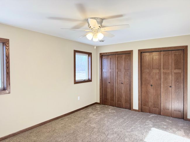 Primary bedroom with double closets. | Image 7