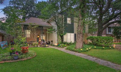 This frontal view shows the tasteful colors used on the exterior with the front porch and covered swing by long the driveway. Time to relax on the backyard retreat or pool. Which one... | Image 1