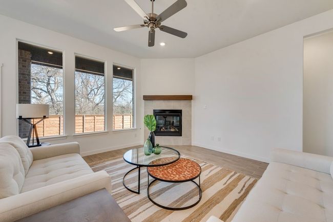 Living room featuring healthy amount of natural light, ceiling fan, light wood-type flooring, and recessed lighting | Image 12
