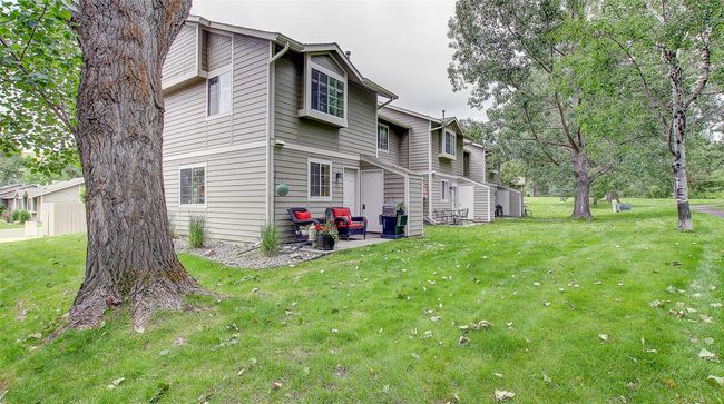 View of side of home featuring a lawn and a patio | Image 28