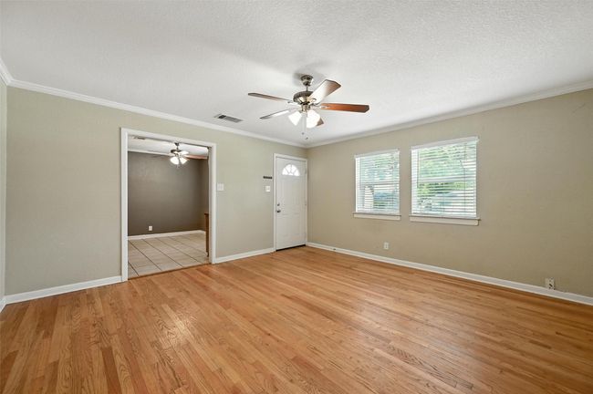 Unfurnished dining area with a ceiling fan and light tile patterned floors | Image 8