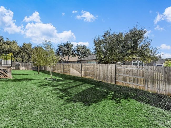 View of fenced backyard | Image 35