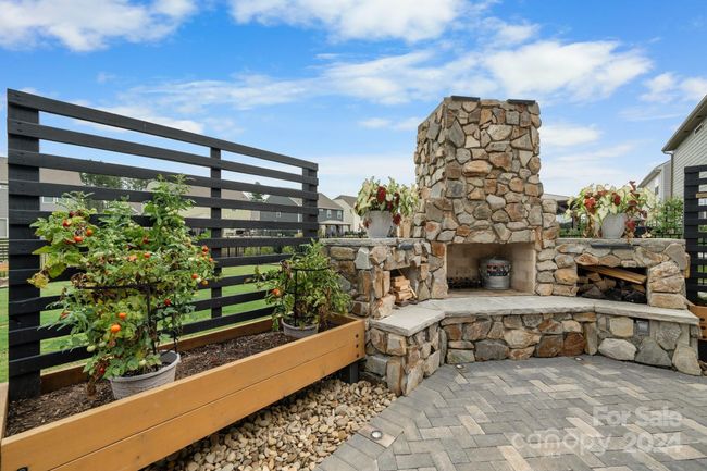 Custom planters remain. Lattice fences provide privacy for your backyard entertaining! | Image 36
