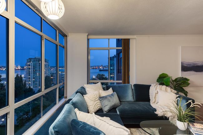 Living area with a view of city, a water view, ornamental molding, and a wall of windows | Image 9