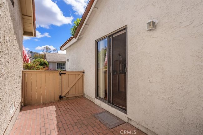 The side patio area has access to the front yard​​‌​​​​‌​​‌‌​‌‌​​​‌‌​​‌‌​‌​​​​​‌ space | Image 24